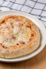 Cheese Pizza on a wooden table