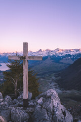 Mountain cross in front of the famous mountains Eiger, Mönch and Jungfrau in the Swiss alps, Switzerland, Bernese Highlands