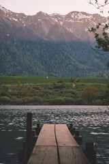 Pier on a lake in front of the Swiss alps, Switzerland