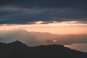 Sunbeams seeking through the clouds just before sunset, Switzerland, Interlaken