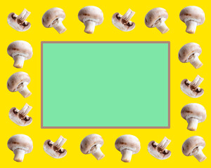 champignon mushrooms on a yellow background, frame, green background template with copy space