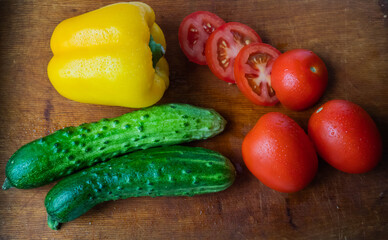 green cucumbers,red tomatoes, yellow peppers
