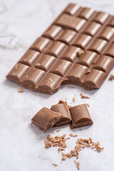 Delicious and tasty milk chocolate bar on a white background