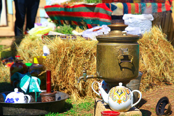 Caucasian samovar tea in the garden with kettle