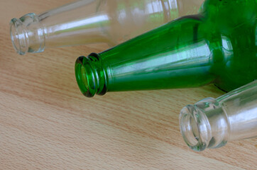Three empty beer bottles lie on the table.