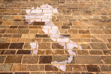 Italy drawn on the tiles of a pavement