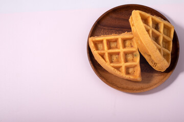 Two waffles on a white background. Copy space