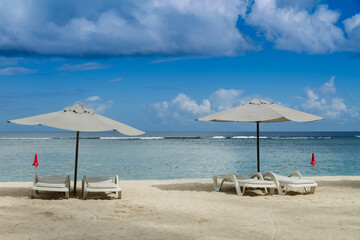 tropical beach with umbrella