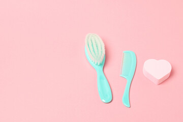 Baby care accessories on pink background flat lay