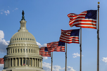 Capitol building in Washington, DC with United States flags