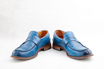 Pair of old leather blue discarded boots with laces