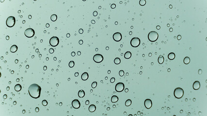 Close up Drops of water on the glass. Macro shooting. Texture. No people.
