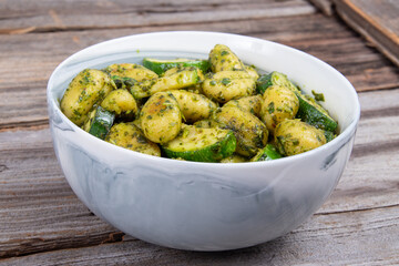 potato gnocchi pasta with zucchinis and fresh pesto