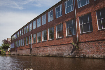 old brick warehouse at a river