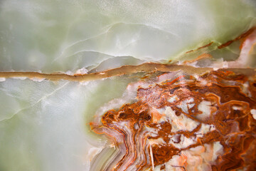 Close up of the texture and patterns of a cut raw jade rock