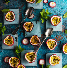 top view of fresh ripe delicious passion fruits with mint leaves