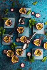 top view of fresh ripe delicious passion fruits with mint leaves