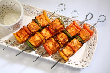 Tandoori Paneer Tikka or Marinated Cheese cubes with spices and yogurt, Indian Dish