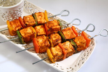 Tandoori Paneer Tikka or Marinated Cheese cubes with spices and yogurt, Indian Dish