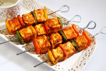 Tandoori Paneer Tikka or Marinated Cheese cubes with spices and yogurt, Indian Dish