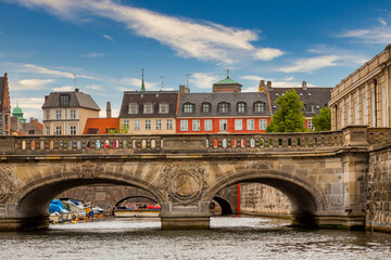 Naklejka premium Photo of Copenhagen tourist landmark spot taken during a boat ride across the city canals, on a hot summer day with bright sky.