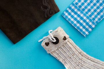 Bavarian traditional clothing isolated on a blue background