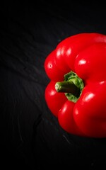 red pepper on a black background