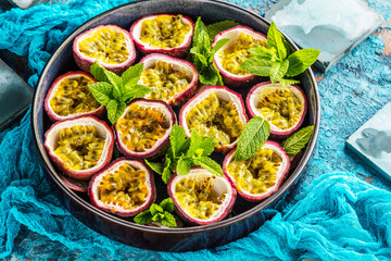 top view of fresh ripe delicious passion fruits with mint leaves