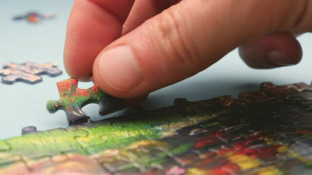 The concept of making decision skill. Different pieces of puzzle. Task divided into different pieces. Indoor game. Family leisure time. Spending time with family.