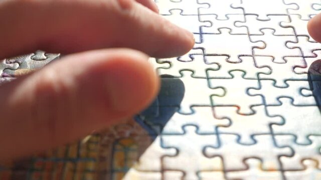 Final result background. Last piece of puzzle for whole picture. Concept: cooperation, teamwork, creativity, access solution. Creative completes the picture of jigsaw puzzle putting last missing piece