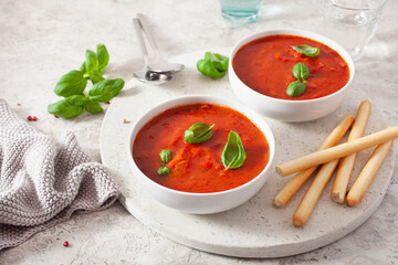tomato and bell pepper vegetarian soup on green background