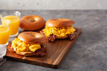 breakfast egg and bacon sandwich on bagel with cheese