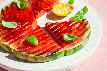 grilled watermelon slices with lemon and basil. summer dessert