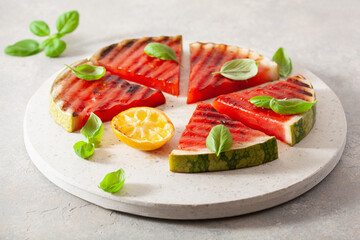 grilled watermelon slices with lemon and basil. summer dessert