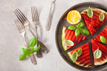 grilled watermelon slices with lemon and basil. summer dessert