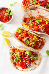 mexican beef and pork tacos with salsa, guacamole and vegetables