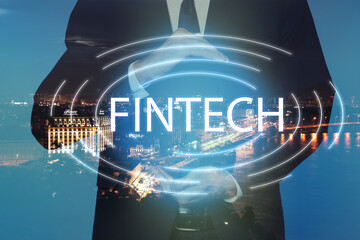 Fintech concept. Double exposure of cityscape and businessman, closeup