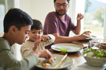 Family eating lunch at table