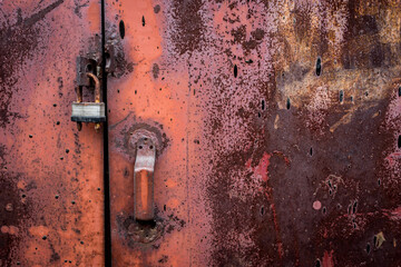 The old iron background is painted in red, pink, purple with rust and chips.