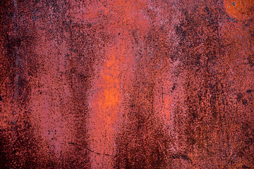 The old iron background is painted in red, pink, purple with rust and chips.