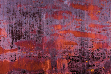 The old iron background is painted in red, pink, purple with rust and chips.