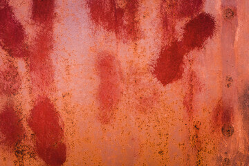 The old iron background is painted in red, pink, purple with rust and chips.