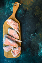 pink salmon frozen raw fish seafood in ice quick freeze Menu concept serving size. food background...