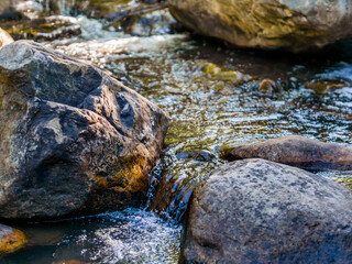 Fototapeta na wymiar Mountain stream with pure spring water