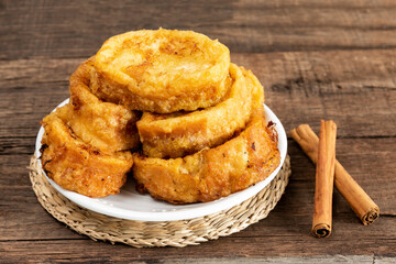 Easter dessert.Traditional homemade Spanish French toast on wooden background.