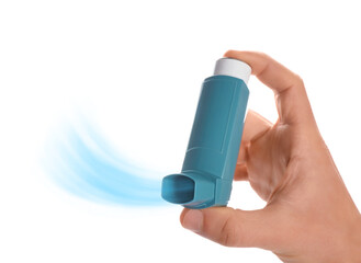 Man holding asthma inhaler with steam on white background, closeup