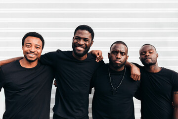 Black cool guys posing over white background looking at camera