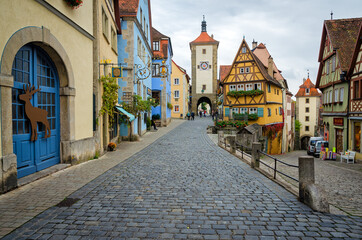 Fototapeta na wymiar ROTHENBURG OB DER TAUBER, GERMANY - OCTOBER 18, 2016: The Plonlein (Little Square) with the Siebers Tower on the left and Kobolzell Gate on the right, one of the most photographed spots in the world.