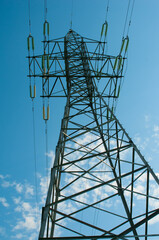 High electric power mast on blue sky background