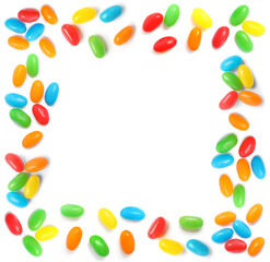 Frame made of delicious color jelly beans on white background